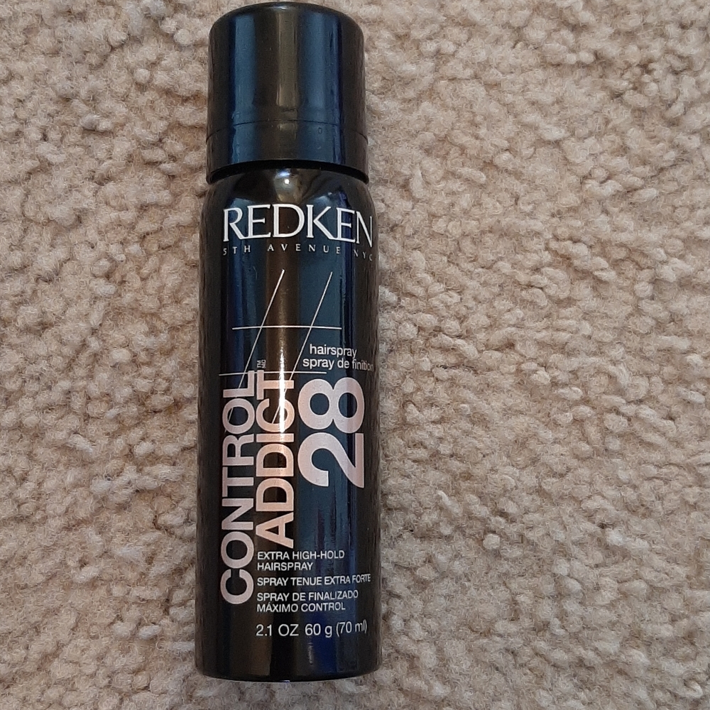 Extra hold hair.  Control addict 28 by Redken